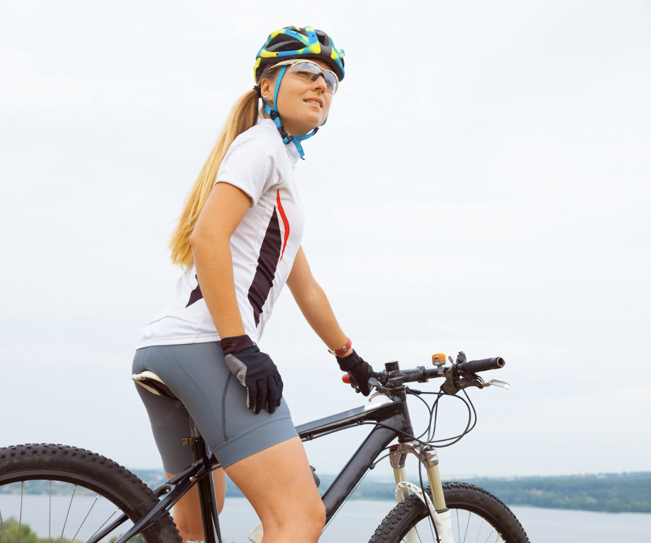 Slim woman cycling on a mountain bike